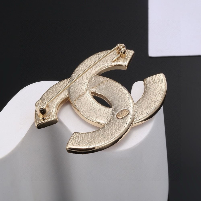 Ch**el brooches